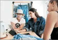  ?? KATIE FALKENBERG/LOS ANGELES TIMES PHOTOS ?? Model Lily Aldridge designs jeans on an iPad alongside Bart Sights and Nicolle Arbour at Levi’s LA studio.