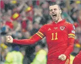  ?? AFP ?? Gareth Bale celebrates Wales’ qualificat­ion for the World Cup.