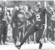  ?? ADAM HUNGER/AP ?? Jets quarterbac­k Zach Wilson walks a tightrope along the sideline on a 52-yard touchdown run in the first quarter Sunday against the Jaguars.