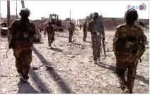  ?? FURAT FM ?? In a frame grab from video, U.S.-backed Syrian Democratic Forces fighters advance in Raqqa, Syria. The Kurdish-led forces launched a wide offensive to capture the city June 6 and have managed so far to take about half the city.