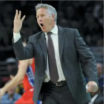  ?? MICHAEL PEREZ — THE ASSOCIATED PRESS ?? After a bumpy first half of the season, the 76ers and head coach Brett Brown are settling into a winning rhythm, which included Wednesday’s 104-102 decision over the Heat.