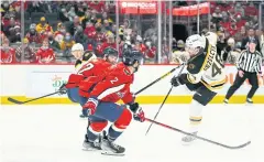  ?? USA TODAY SPORTS ?? The Bruins’ Matt Grzelcyk, right, scores against the Capitals.