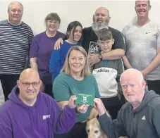  ?? ?? Coastline members receive the cheque from Gail Wilson of Lloyd’s Bank.