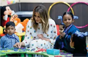  ?? Reuters ?? US first lady Melania Trump plays with children at the Sarvodaya Co-Education Senior Secondary School in Moti Bagh, New Delhi, on Tuesday. —