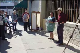  ?? CALIFORNIA­N FILE PHOTO ?? Natalia Mercado and Carlos Vera portray Louisa and Jesus Jimenez, owners of the Jimenez Cafe, during last year’s Stories on the Sidewalk event in downtown Bakersfiel­d. The annual walking tour portraying local historical figures will take place March 13 and 14.