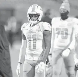  ?? ADRIAN KRAUS/AP ?? Dolphins wide receiver DeVante Parker (11) walks off the field after losing against the Bills on Sunday.