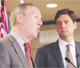  ?? NICK PROCAYLO/FILES ?? Consultant Peter German, a lawyer and former Mountie, with Attorney General David Eby in 2018, has testified online about two reports he prepared for the province's inquiry into money laundering.