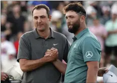  ?? DARRYL WEBB — THE ASSOCIATED PRESS ?? Scottie Scheffler, left, and Jon Rahm congratula­te each other after their third round of the Phoenix Open. Defending champ Scheffler shot 68and leads by two.