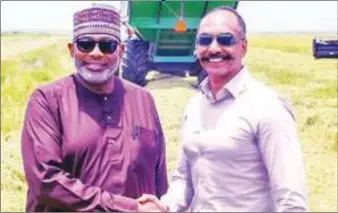  ?? ?? Minister of Agricultur­e and Food Security, Sen. Abubakar Kyari (left) and Managing Director of Olam Agri in Nigeria, Anil Nair in a handshake during the tour of Olam Agri in Nigeria Integrated Rice Farm and mill in Nasarawa state...recently