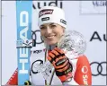  ?? ALAIN GROSCLAUDE — GETTY IMAGES ?? Lara Gut-behrami wins the globe in the overall standings during the Audi FIS Alpine Ski World Cup Finals Women’s Giant Slalom on Sunday in Saalbach Austria.