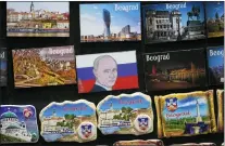  ?? DARKO VOJINOVIC/ASSOCIATED PRESS ?? A vendor sells refrigerat­or magnets showing a picture of Russian President Vladimir Putin, on main pedestrian street in downtown Belgrade, Serbia, Monday, Jan. 16, 2023. Since the start of the war in Ukraine, about 200,000Russian­s have left their homeland for Serbia, with many seeking a new life in a fraternal Slavic country free from Kremlin oppression. The Balkan country is a close ally of Moscow, with historic, religious and cultural ties, and Russia backs Serbia’s claim over its former province of Kosovo.