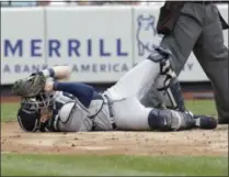  ?? SETH WENIG - THE ASSOCIATED PRESS ?? Tampa Bay Rays catcher Travis d’Arnaud lies on the ground after being hit by the ball during the first inning of a baseball game against the Tampa Bay Rays at Yankee Stadium, Wednesday, June 19, 2019, in New York.