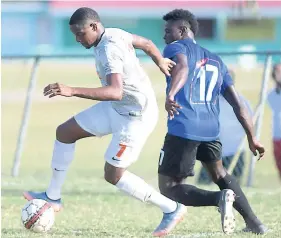  ?? FILE ?? Ryan Miller (left) playing for UWI FC against Cavalier SC in the Red Stripe Premier League on Sunday, March 11.