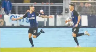  ?? Reuters ?? Inter Milan’s Mauro Icardi (left) celebrates after scoring against Lazio during their Italian League match at the Olympic Stadium in Roma on Monday.