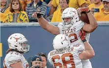  ?? Nick Wagner / Associated Press ?? At 6-7, 310 pounds, UT’s Sam Cosmi combines size, strength, mobility, intelligen­ce and a strong knowledge of the game.