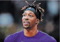  ?? DAVID ZALUBOWSKI
THE ASSOCIATED PRESS FILE PHOTO ?? Los Angeles Lakers centre Dwight Howard believes his time would be better spent with his family than playing basketball.
