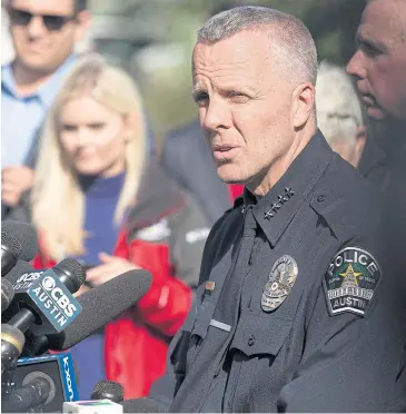  ?? EPA ?? Interim Chief of Police Brian Manley, left, speaks with the media while investigat­ing a fourth bombing this month in Austin, Texas on Monday. Police suspect the bombings are related.