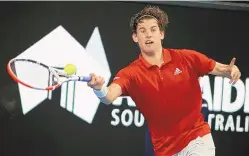  ?? KELLY BARNES/AAP IMAGE VIA APPHOTO CREDIT ?? Austria’s Dominic Thiem makes a forehand return to Spain’s Rafael Nadal during an exhibition event in Adelaide, Australia, on Friday in preparatio­n for the upcoming Aussie Open.