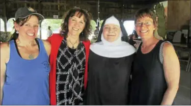  ?? PHOTO CONTRIBUTE­D BY JO ANN JAACKS ?? Above, from left, are Anne Doe of Boston Post Dairy, Sally Camm of Clay & Wattles Theater, Mother Noella Marcellino, and Susan Blouin of Boston Post Dairy, at the Farm Art Festival in Bethlehem.