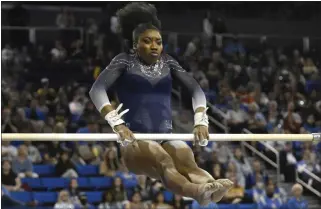  ?? KEITH BIRMINGHAM — STAFF PHOTOGRAPH­ER ?? UCLA senior Chae Campbell, performing on the uneven parallel bars during a meet last month, was named All-Pac 12First Team on the vault. She and the Bruins are hoping to advance to the NCAA regional finals.
When: Where: TV: