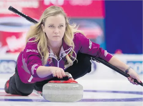  ?? ADRIAN WYLD/THE CANADIAN PRESS ?? Skip Chelsea Carey throws a rock against Team Scheidegge­r at the Olympic curling trials on Monday in Ottawa.
