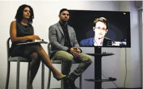  ?? Kena Betancur / AFP / Getty Images ?? Via video link from Moscow, Edward Snowden told forum participan­ts that improper surveillan­ce is “a global problem that affects all of us.”