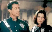  ?? ?? Sylvester Stallone and Sandra Bullock teamed up for Demolition Man.