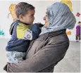  ?? ?? Khala, 35, a teacher, with her son at a deradicali­sation centre in Hasakah