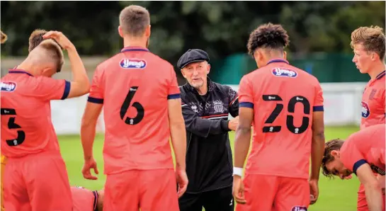  ?? Picture: Jon Corken ?? Ian Holloway talks to his Grimsby players during a pre-season game at Cleethorpe­s. But Grimsby had to call off last weekend’s game at Cheltenham and their next scheduled League Two match, against Bradford