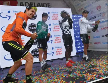  ?? Picture: DAVID MARIUZ, EPA ?? CHAMPAGNE SHOWERS: Daryl Impey celebrates with Peter Sagan, Nicholas Dlamini and Egan Bernal after stage six of the Tour Down Under in Adelaide on Sunday.