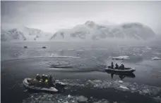  ?? Reem Mohammed / The National; AFP ?? The plight of the ice-bound MV Akademik Shokalskiy in 2013, top, gives an idea of the unforgivin­g landscape to be faced by Team Zayed. Mariam Al Qassimi, Winston Cowie, and Rashed Al Zaabi, above left, will represent the UAE on this month’s trip. They...