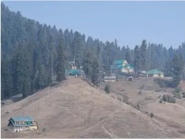  ?? ?? DRY SPELLS. Ski resorts and ski slopes usually covered in snow at this time of the year at a ski station in Gulmarg brown and bare.