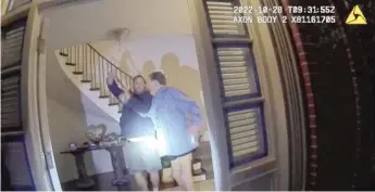  ?? ?? An image from police body-worn camera footage shows Paul Pelosi (right) fighting for control of a hammer with his assailant, David DePape, during an attack in October at Pelosi’s San Francisco home.