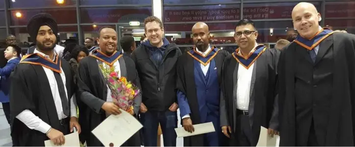  ??  ?? Nasir Yasir (second left) following his graduation ceremony at Dundalk Institute of Technology where he obtained a degree in Civil Engineerin­g.