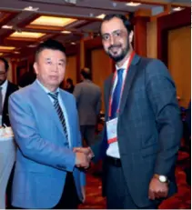  ??  ?? He Zhenwei, Secretary General of the China Overseas Developmen­t Associatio­n, with Javid Ahmad Qaem, Afghan Ambassador to China, at the 12th China Overseas Investment Fair in Beijing on November 25, 2020