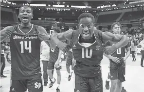  ?? ROBERT GODDIN/ USA TODAY SPORTS ?? St. Peter’s forwards Hassan Drame ( 14) and Fousseyni Drame ( 10) celebrate defeating Murray State in the second round.