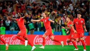  ??  ?? English players celebratin­g having beaten Colombia in penalties.