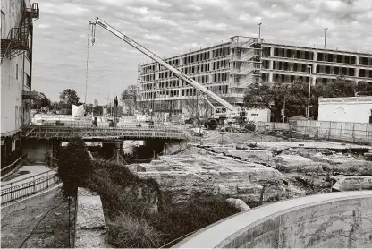  ?? Photos by Billy Calzada / Staff photograph­er ?? The foundation of St. James AME Church can be seen next to constructi­on equipment along Houston Street by San Pedro Creek.