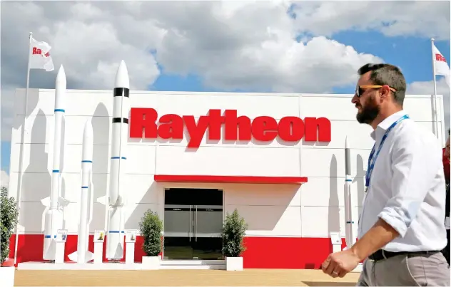  ?? File/reuters ?? ↑
A visitor walks past the stall of Raytheon during an air show in Paris.