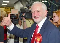  ?? AP ?? Corbyn is greeted as he arrives at Labour party headquarte­rs in London. —