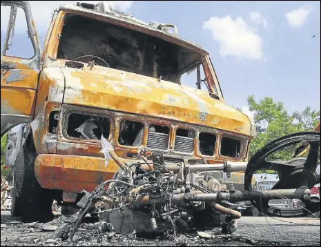  ?? HIMANSHU VYAS/HT ?? Different vehicles, including an ambulance, were set on fire during clashes between police and mob on late Friday night.