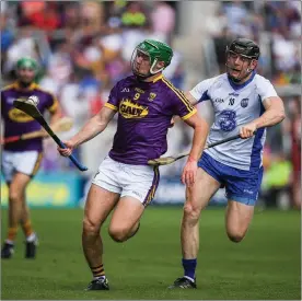  ??  ?? Aidan Nolan trying to get away from Waterford man of the match Kevin Moran near the end of Sunday’s quarter-final in Cork.