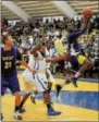  ?? DIGITAL FIRST MEDIA FILE PHOTO ?? In this 2014 file photo, then West Chester University hoops player Ben Mingledoug­h, right, goes up for a layup during a game. He now faces charges connected to a man’s overdose death.