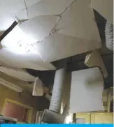  ??  ?? The collapsed kitchen ceiling of an apartment in Salmiya.