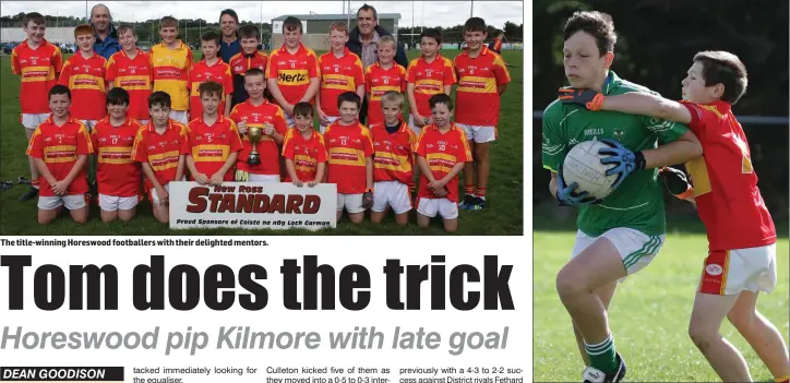  ??  ?? The title-winning Horeswood footballer­s with their delighted mentors. Jake Scallan of Kilmore is tackled by Richard Rice (Horeswood).
