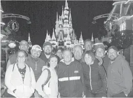  ?? WALT DISNEY WORLD/OSMG ?? That day’s Parkeology Challenger­s all find themselves together at Cinderella Castle as the park closes.