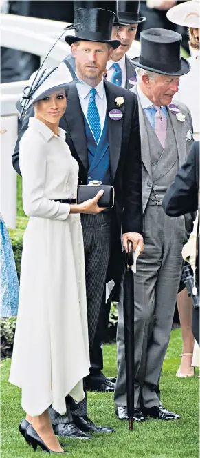  ??  ?? Royal rules: the Duchess of Sussex wears a Givenchy shirt dress as she attends Royal Ascot with the Duke