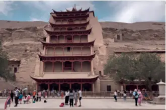  ??  ?? Visitors at the Mogao Caves in Dunhuang, Gansu Province, in July 2018