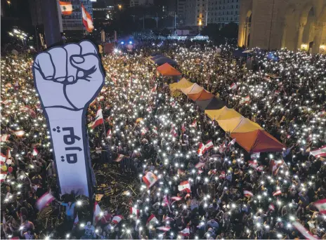  ??  ?? Protesters gather in Martyrs’ Square during the 17th day of anti-government protests in Beirut yesterday