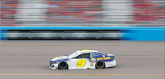  ?? Ralph Freso The Associated Press ?? Fan favorite Chase Elliott races through Turn 4 at Phoenix Raceway on Sunday as he notches his first NASCAR Cup Series championsh­ip.